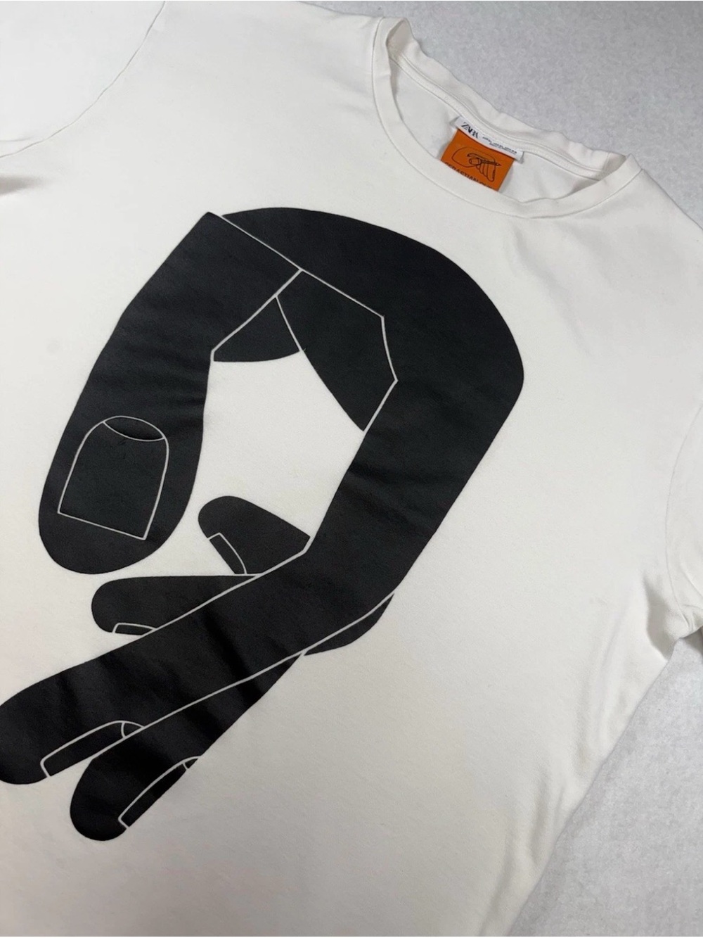 Zara White Short-Sleeve Tee with Black Graphic Hand